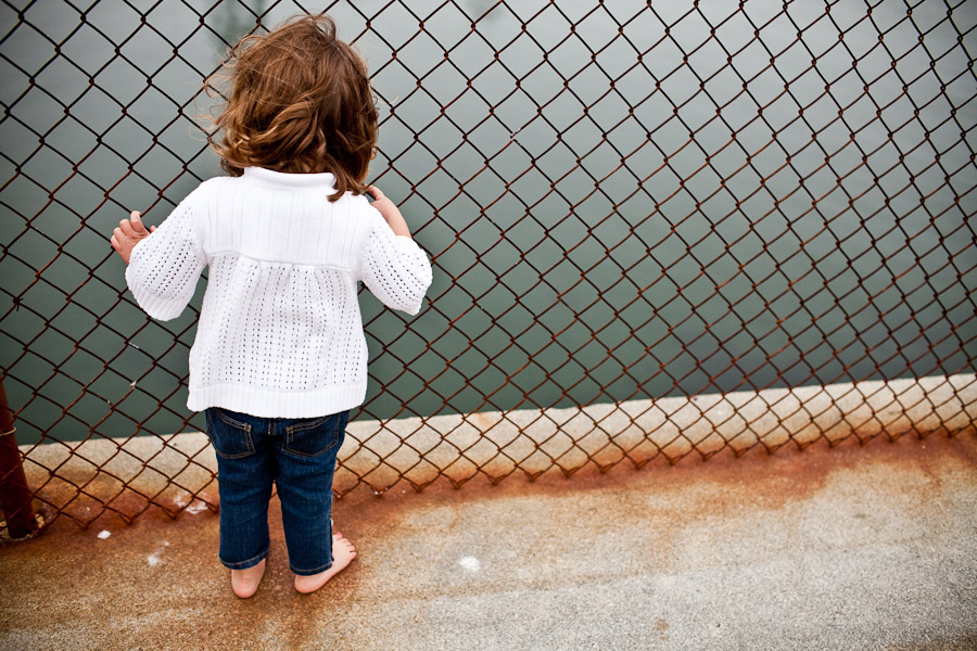 girl stares into ocean