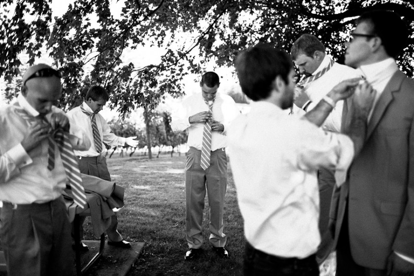 sometimes helping the groom tie their tie is more important than being a photographer